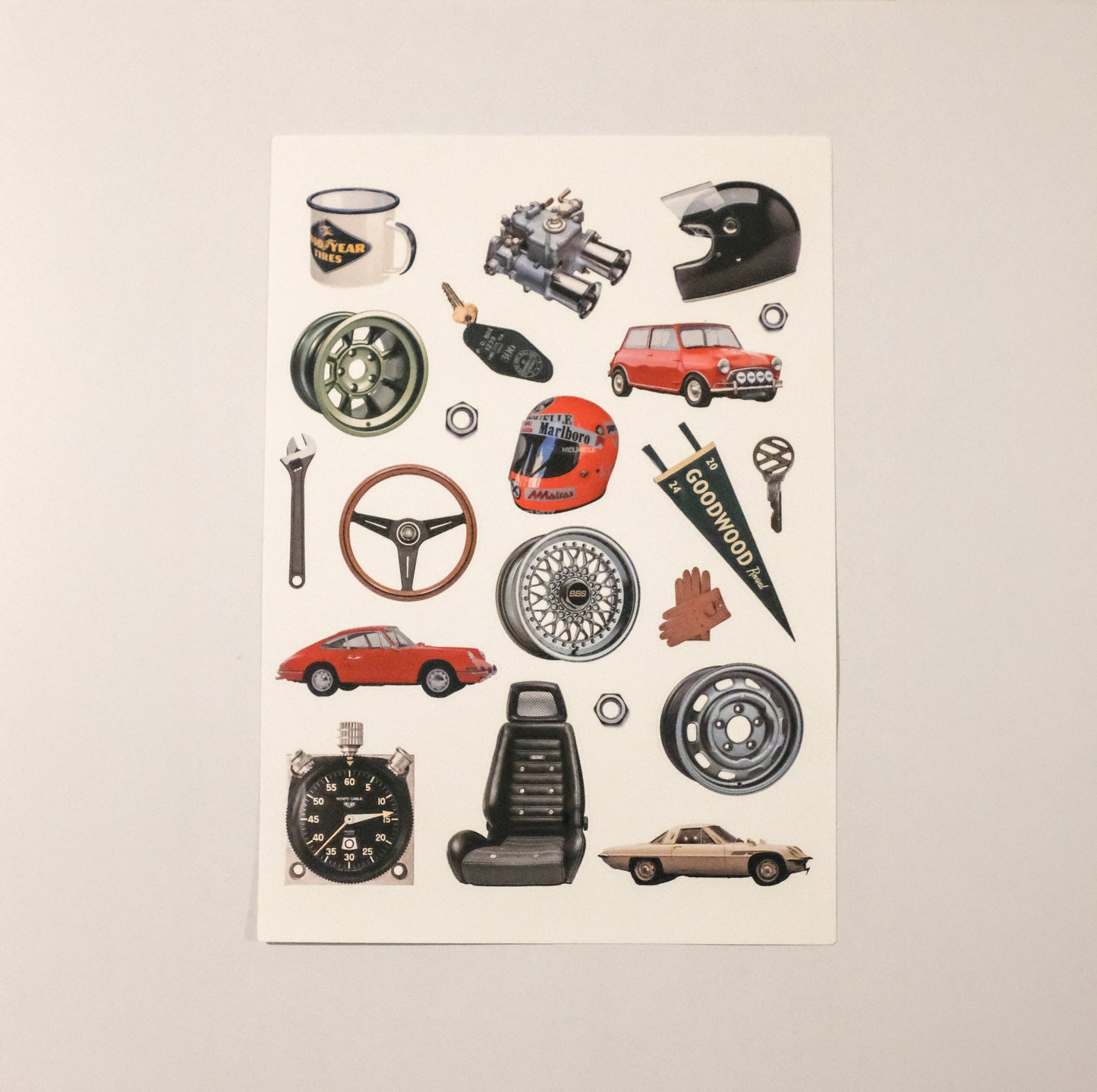 Collection of car-themed stickers on a beige background