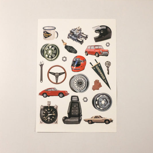 Collection of car-themed stickers on a beige background