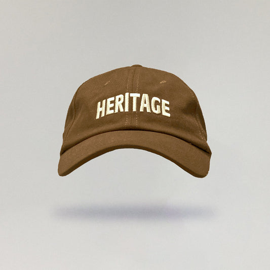 Brown cap with 'HERITAGE' text on a light gray background