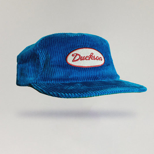 Blue cap with a red and white logo on a light gray background